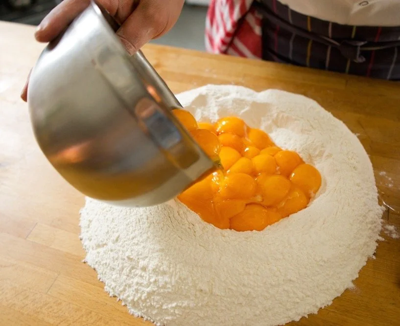 The beginning stages of pasta dough... about 32 yolks per kilo of 00 flour. 