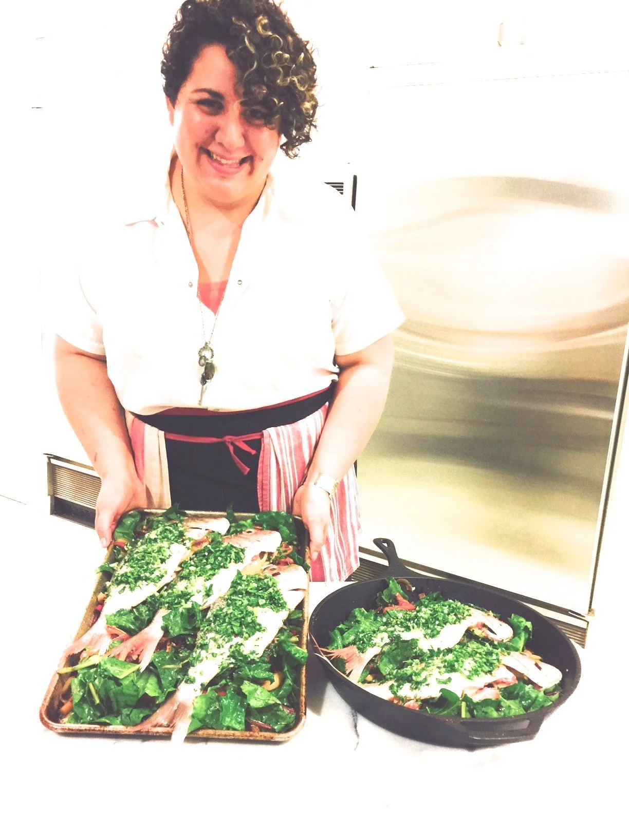 Isabella preparing fish for roasting. 