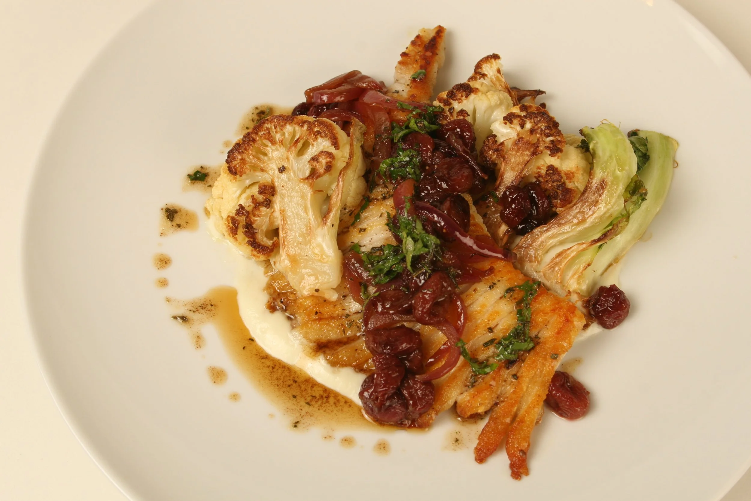 Skate Wing, Cauliflower Puree, Roasted Cauliflower, Pickled Raisins, and Brown Butter. 