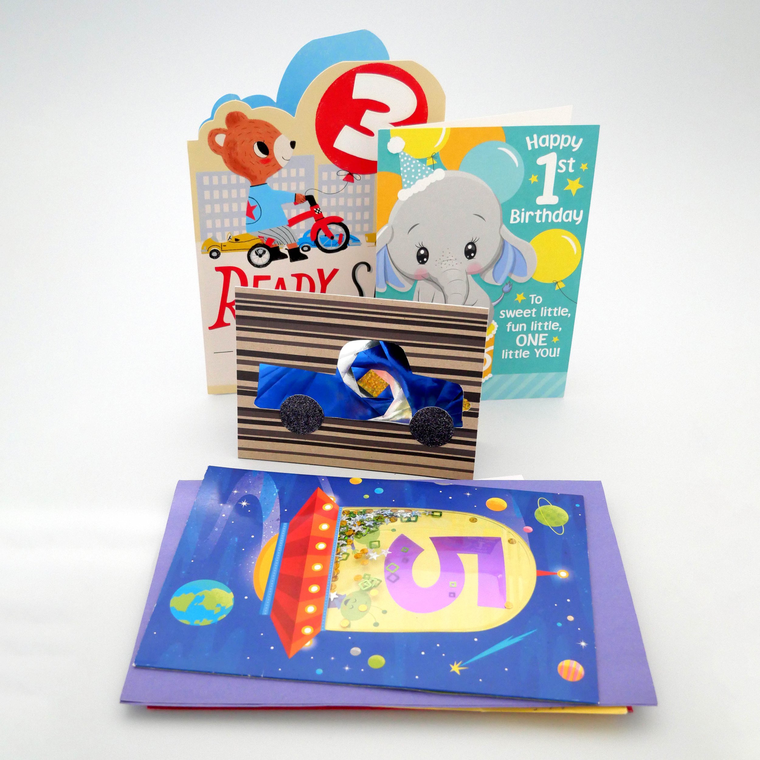 Colorful Greeting cards featuring animals, a rainbow, balloons, and space-themed illustrations.