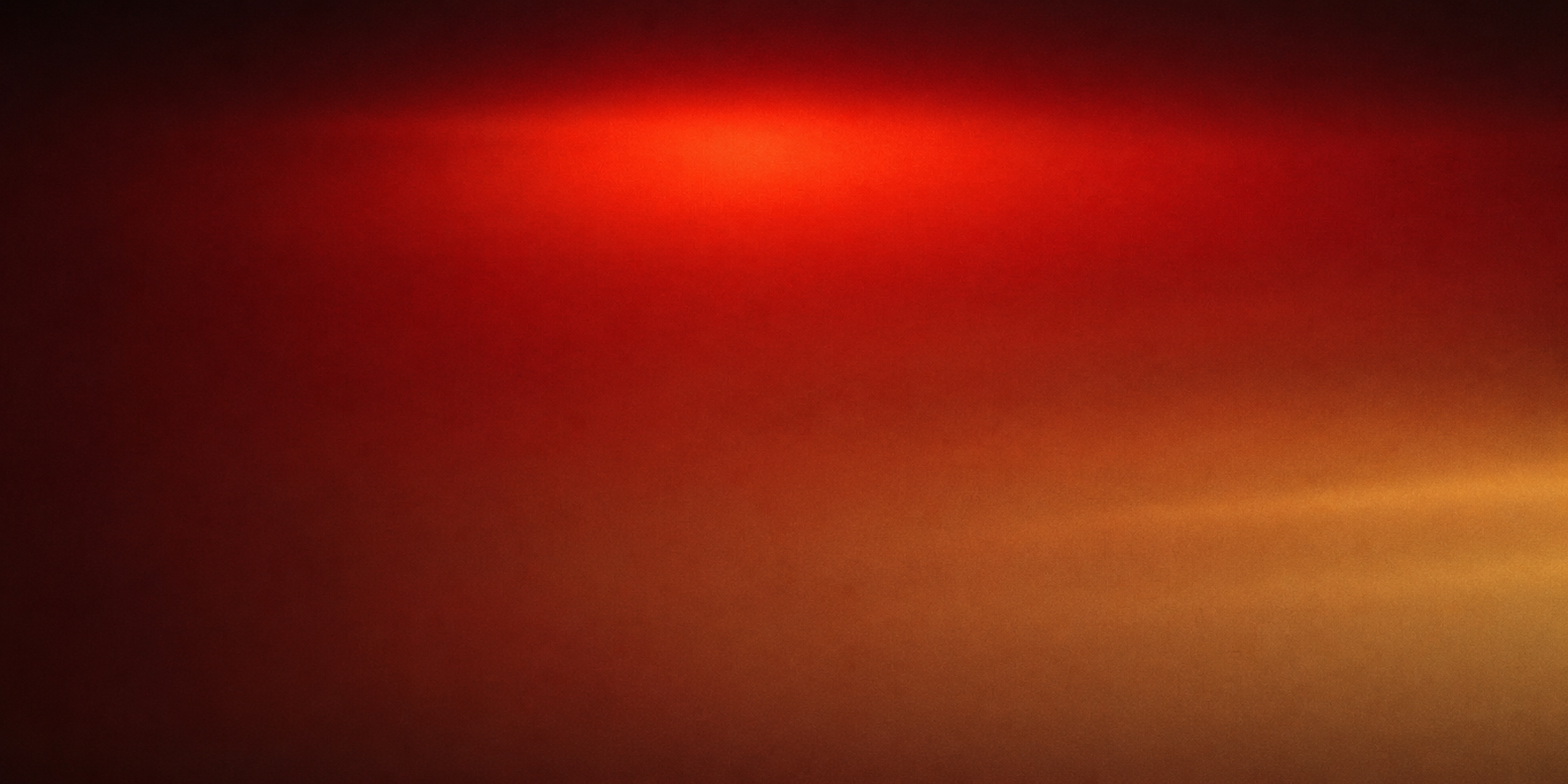Blurred abstract image with red, orange, and black hues
