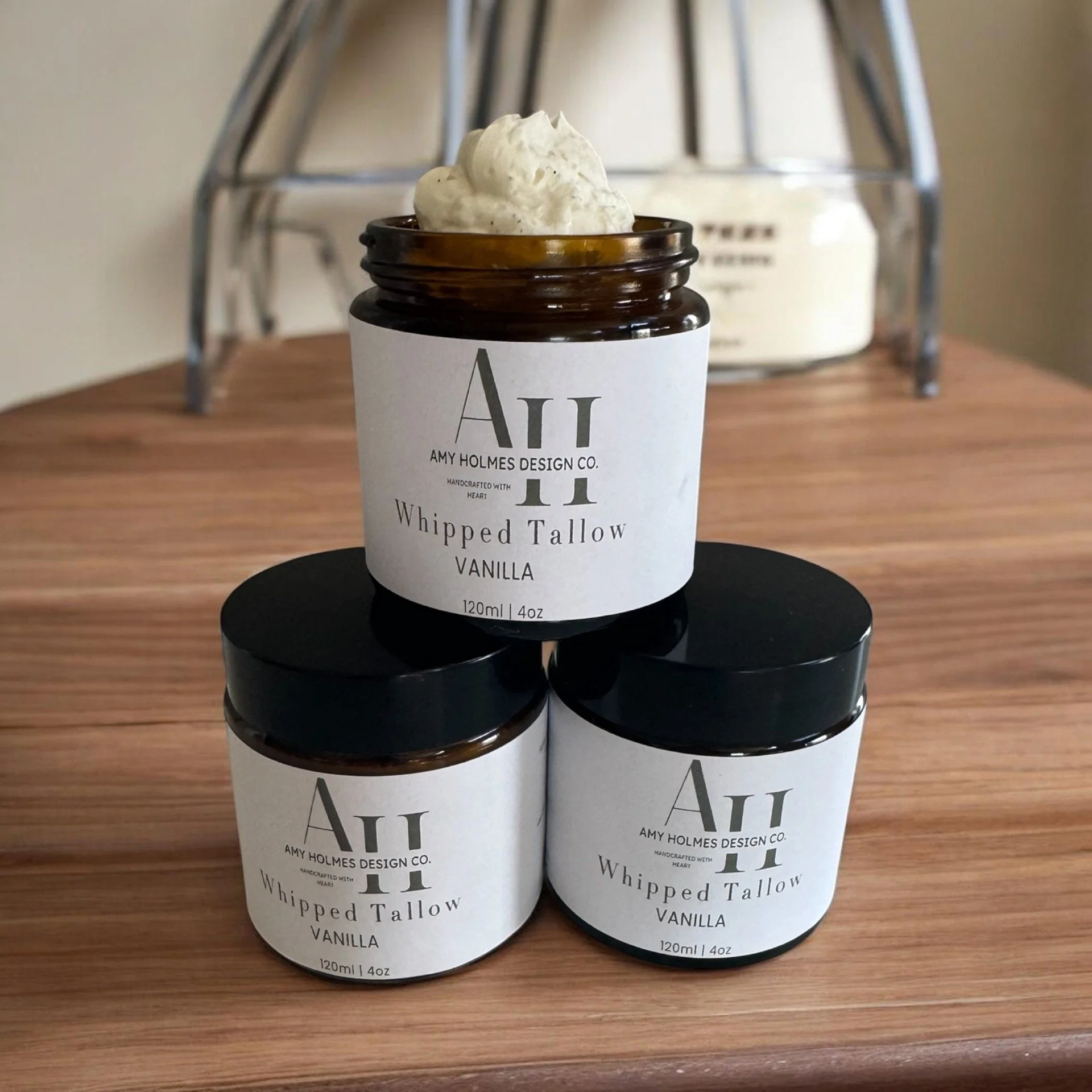 Three amber glass jars of whipped tallow vanilla balm by Basil and Bougie handcrafted skincare moisturizer