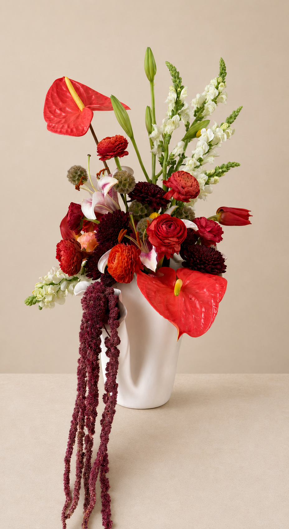 Editorial floral composition with snapdragons, lilies, roses, and anthuriums designed for refined interiors and events.