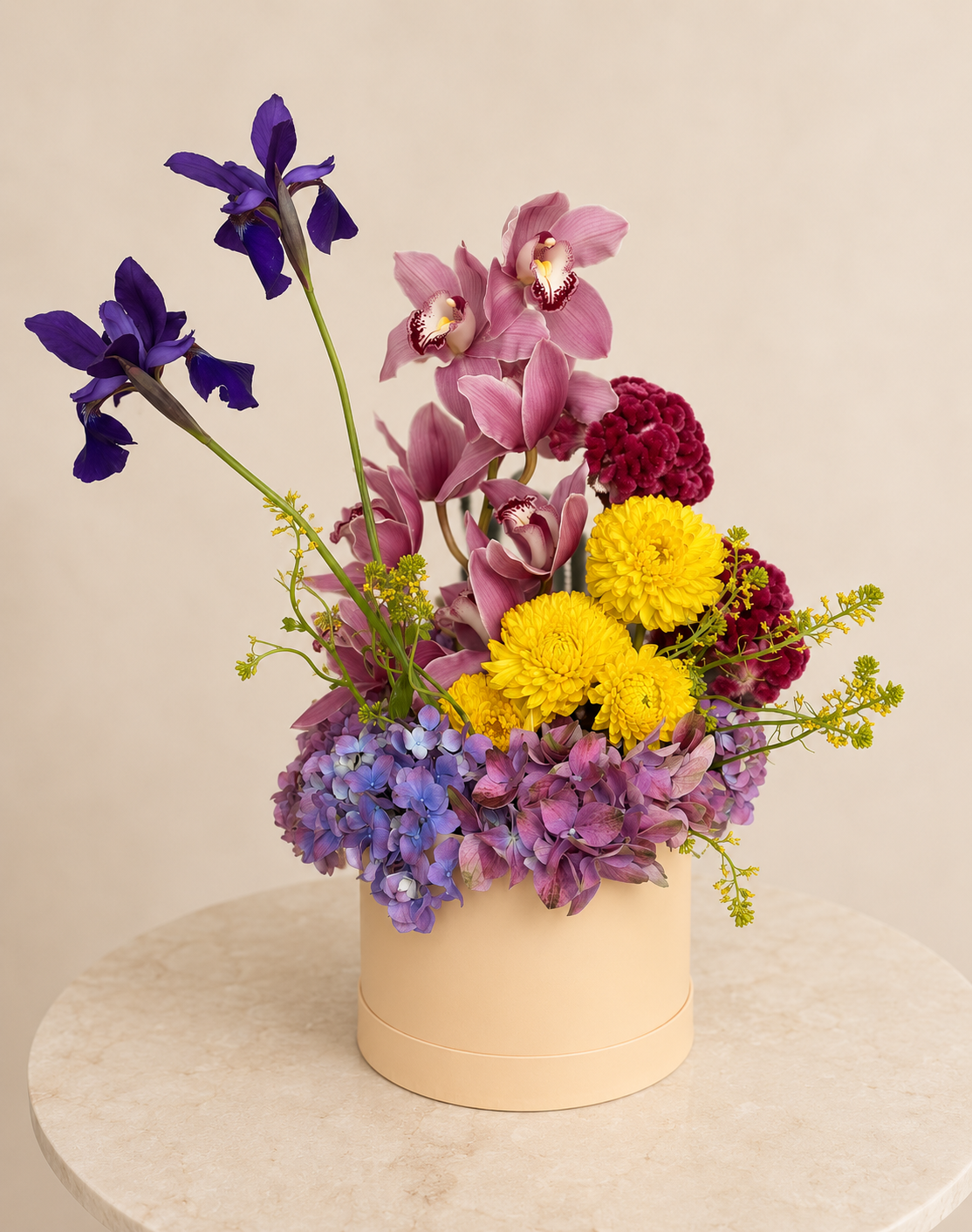 Editorial floral arrangement featuring orchids, irises, hydrangeas, and celosia by luxury florist Stem & Vine Studio.