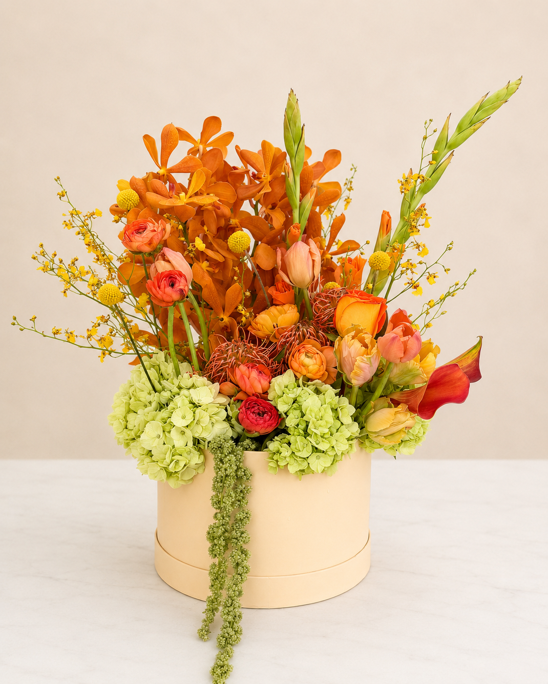 Vibrant luxury floral arrangement featuring orchids, ranunculus, and hydrangeas  designed by Stem & Vine Studio in Moorestown NJ.