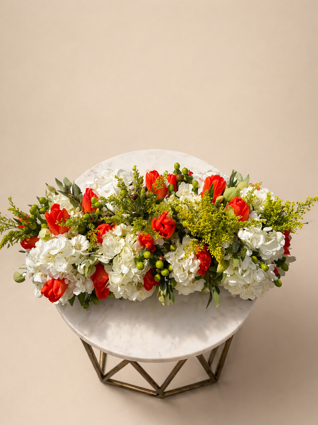 Refined floral centerpiece with roses and seasonal florals designed for luxury interiors, events, and elevated tablescapes.