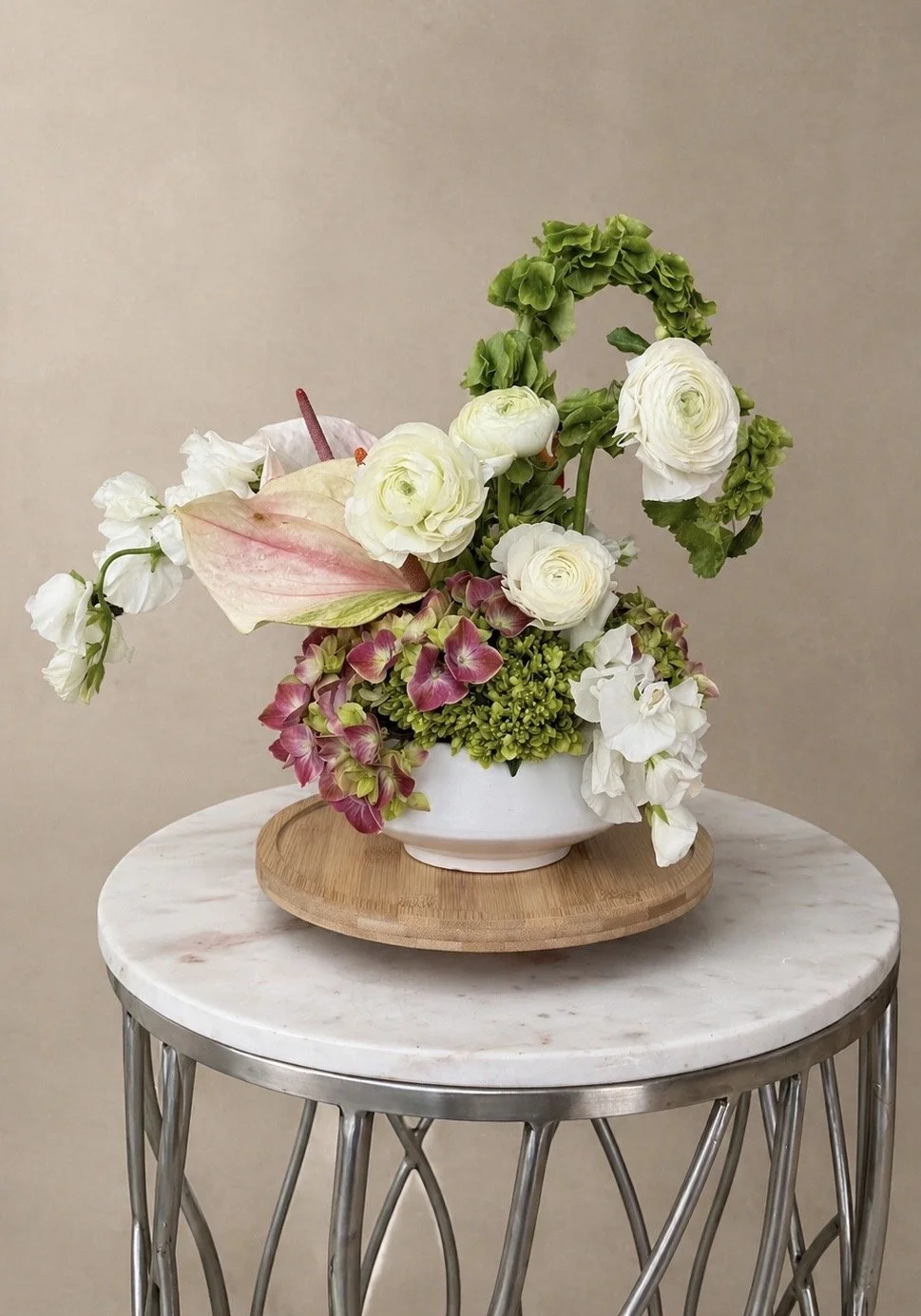 Elegant white and blush floral centerpiece with hydrangeas and roses for upscale interiors and events in South Jersey.