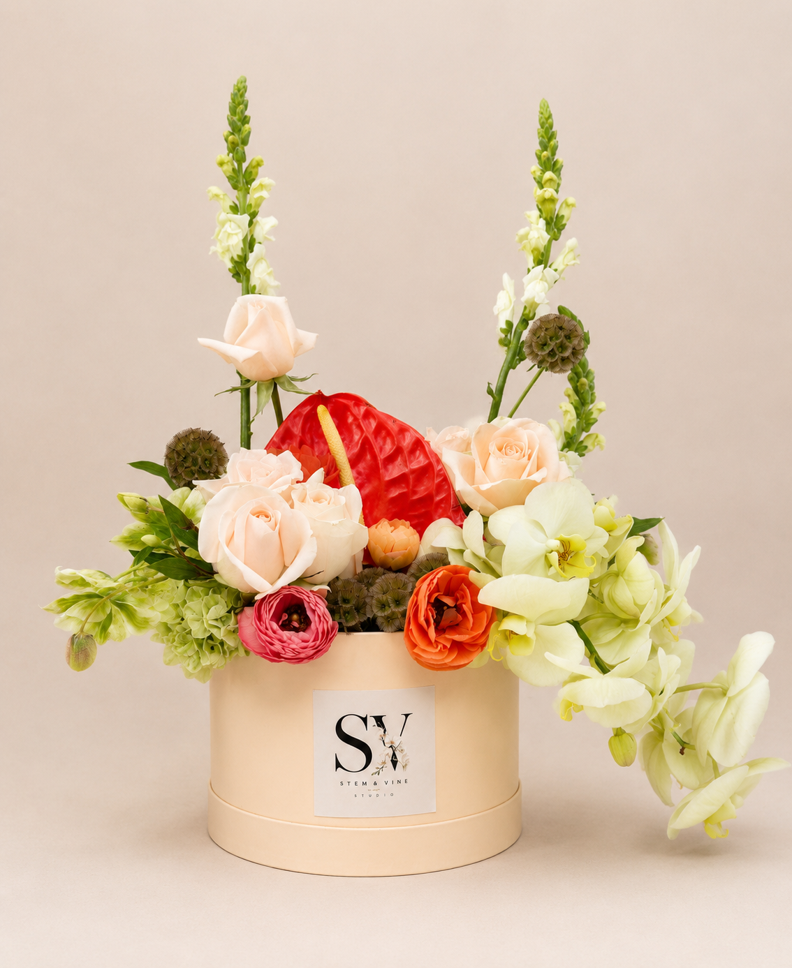 Luxury floral arrangement with roses, ranunculus, and anthuriums designed by Stem & Vine Studio in Moorestown NJ.