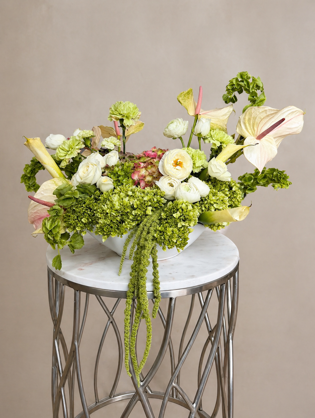 Modern luxury floral centerpiece with roses and and anthuriums designed for weddings and upscale interiors in South Jersey.