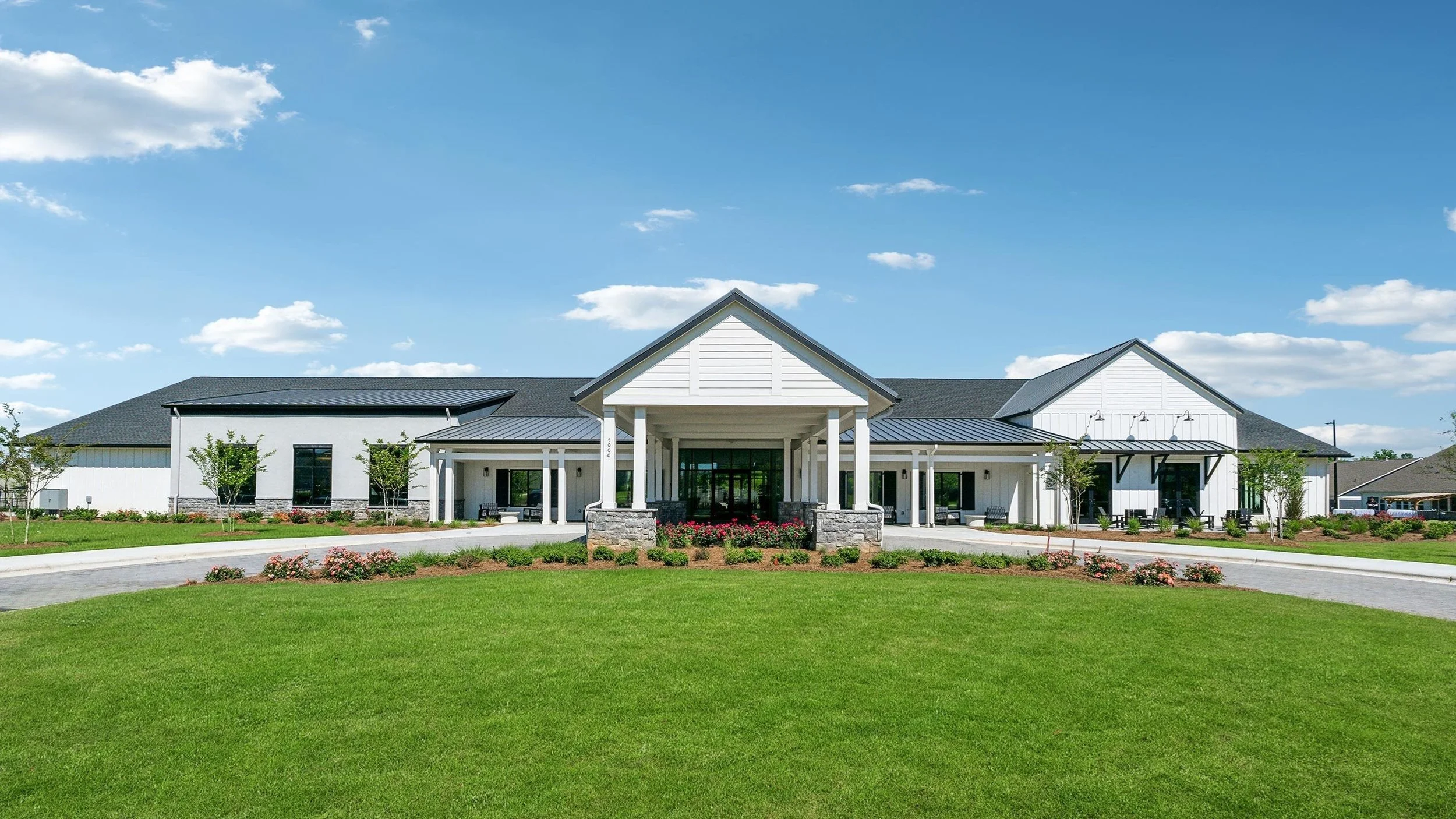 cresswind-at-wesley-chapel-clubhouse-front-exterior-with-lawn-angle-view-55-plus-community-wesley-chapel-nc.jpg