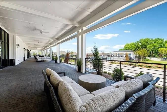 cresswind-at-wesley-chapel-covered-clubhouse-porch-with-lounge-seating-55-plus-community-wesley-chapel-nc.jpg