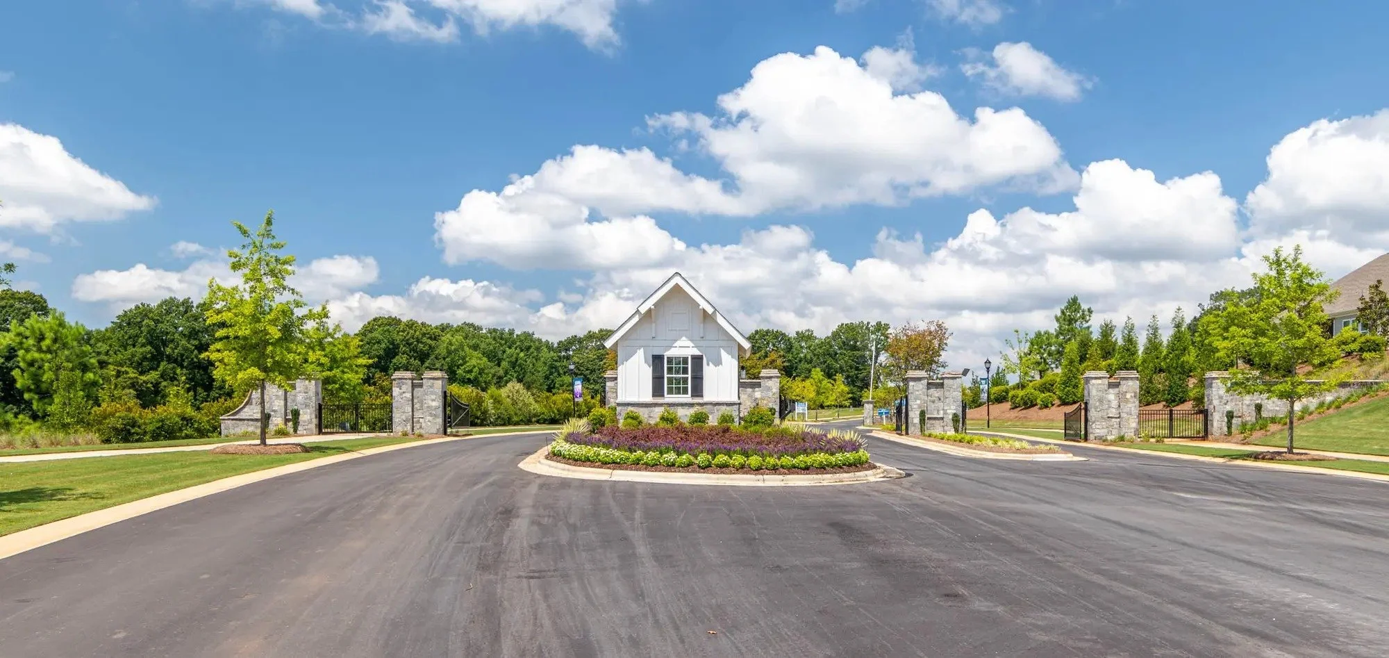 cresswind-at-wesley-chapel-community-entrance-drive-with-clubhouse-in-distance-55-plus-community-wesley-chapel-nc.jpg