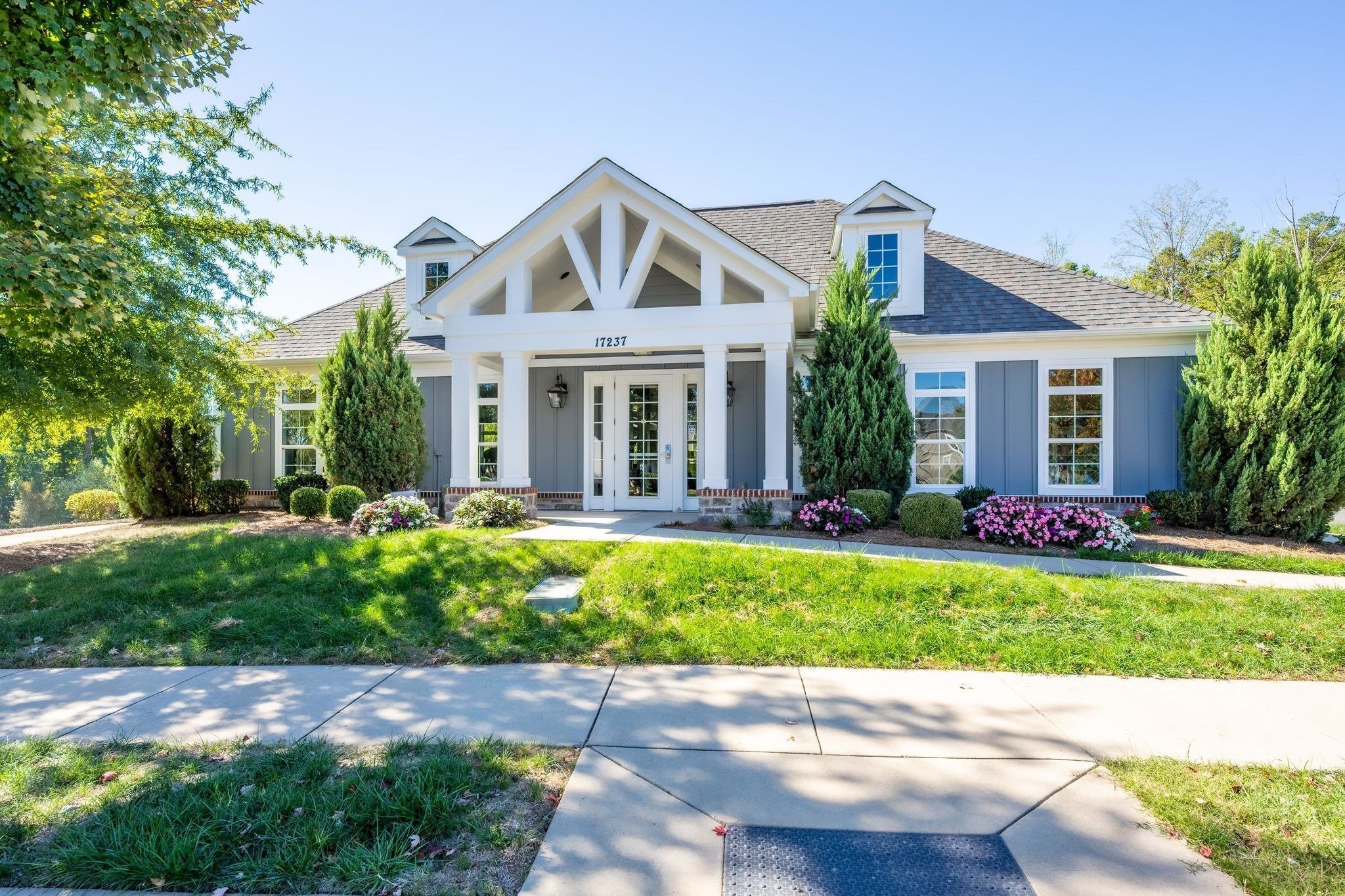 the-courtyards-on-lake-norman-clubhouse-front-exterior-with-landscaping-active-adult-community-cornelius-nc.jpg