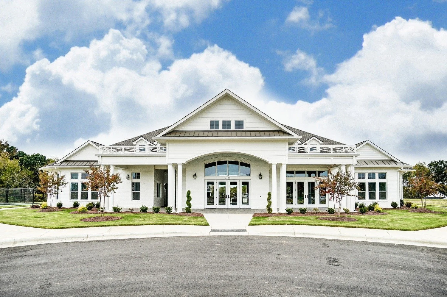 heritage-in-indian-trail-clubhouse-exterior-with-white-columns-active-adult-community-indian-trail-nc.jpg