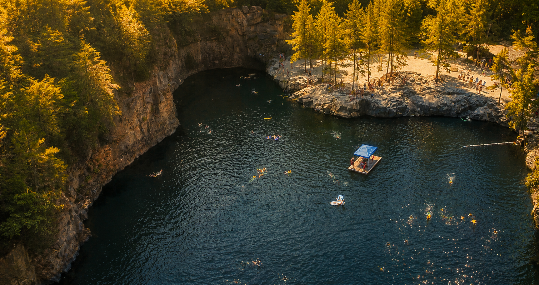 golden-hour-quarry-swim-aerial.png