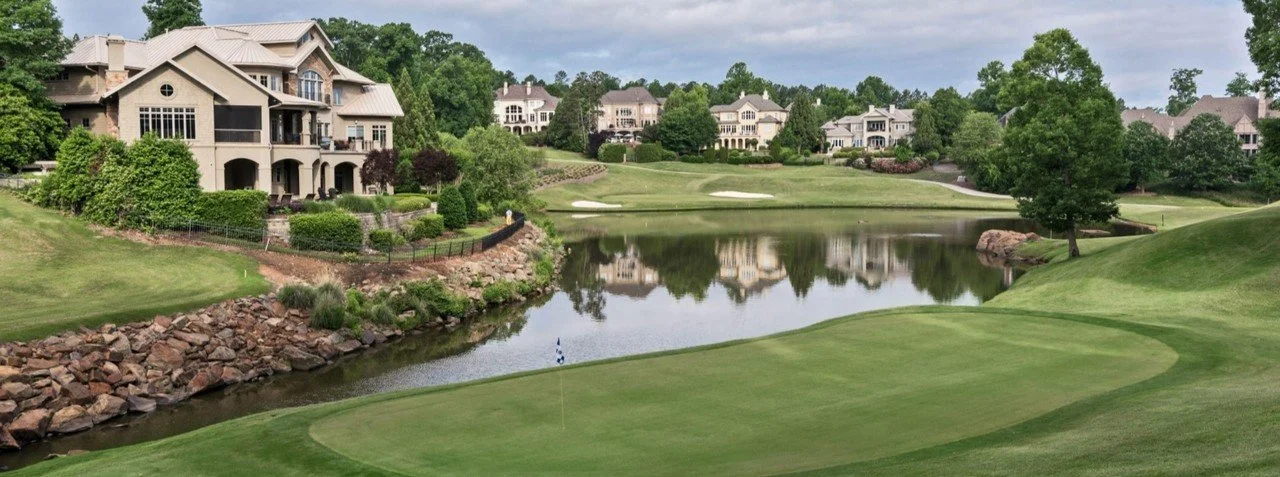 ballantyne-country-club-charlotte-nc-golf-course-with-luxury-homes-and-pond-reflection.jpeg