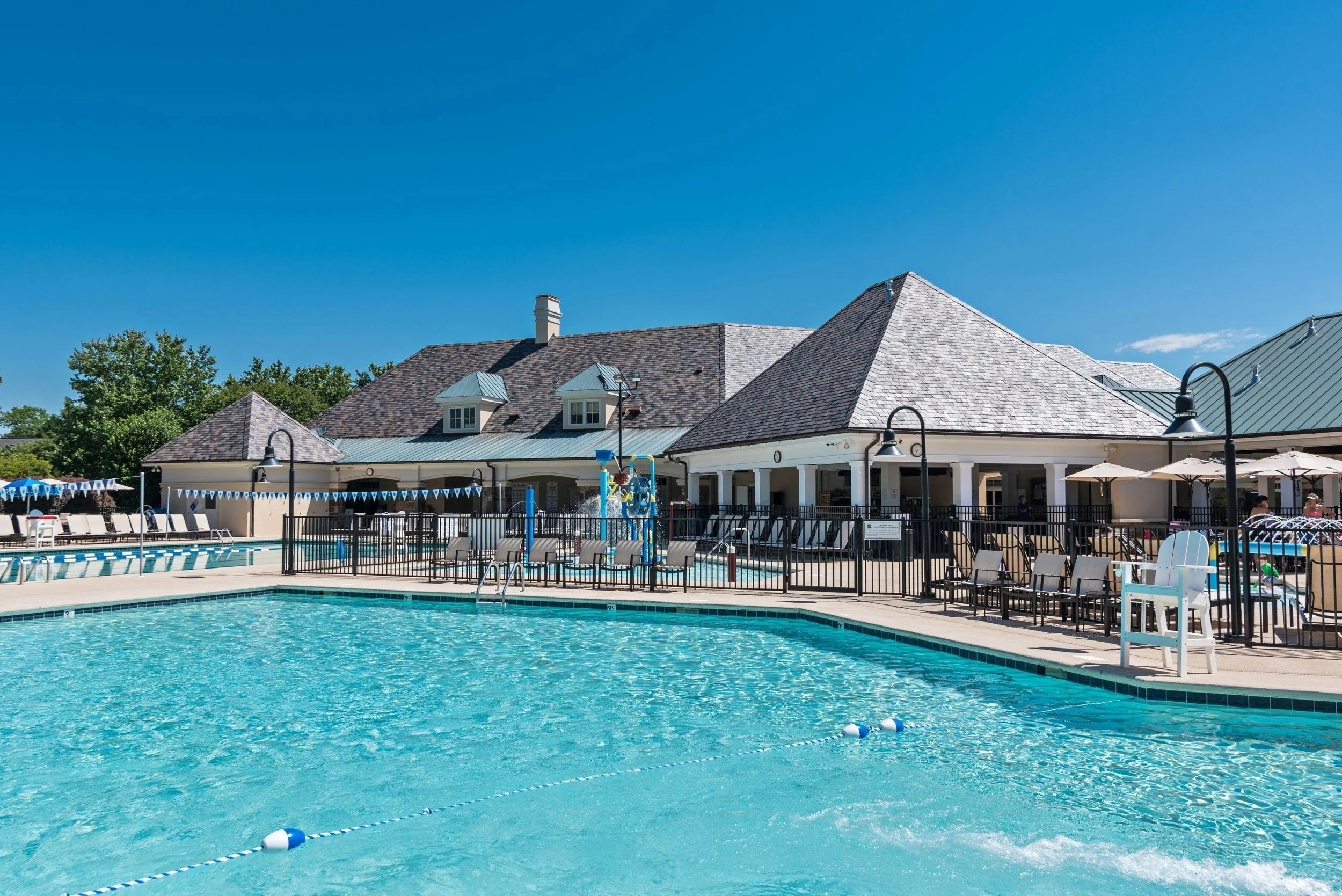 ballantyne-country-club-charlotte-nc-outdoor-pool-with-clubhouse-and-lounge-chairs.jpg
