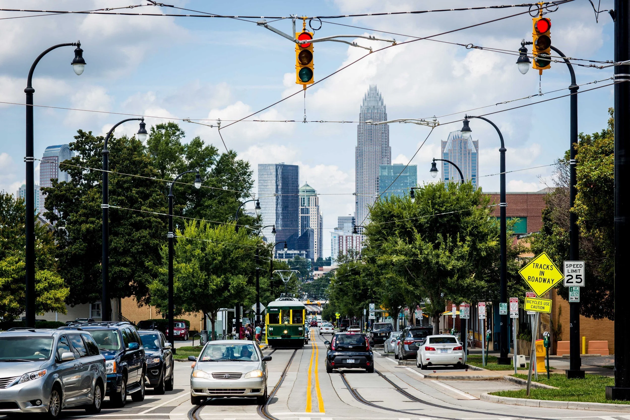elizabeth-charlotte-nc-streetcar-on-central-avenue-with-skyline-view.jpg