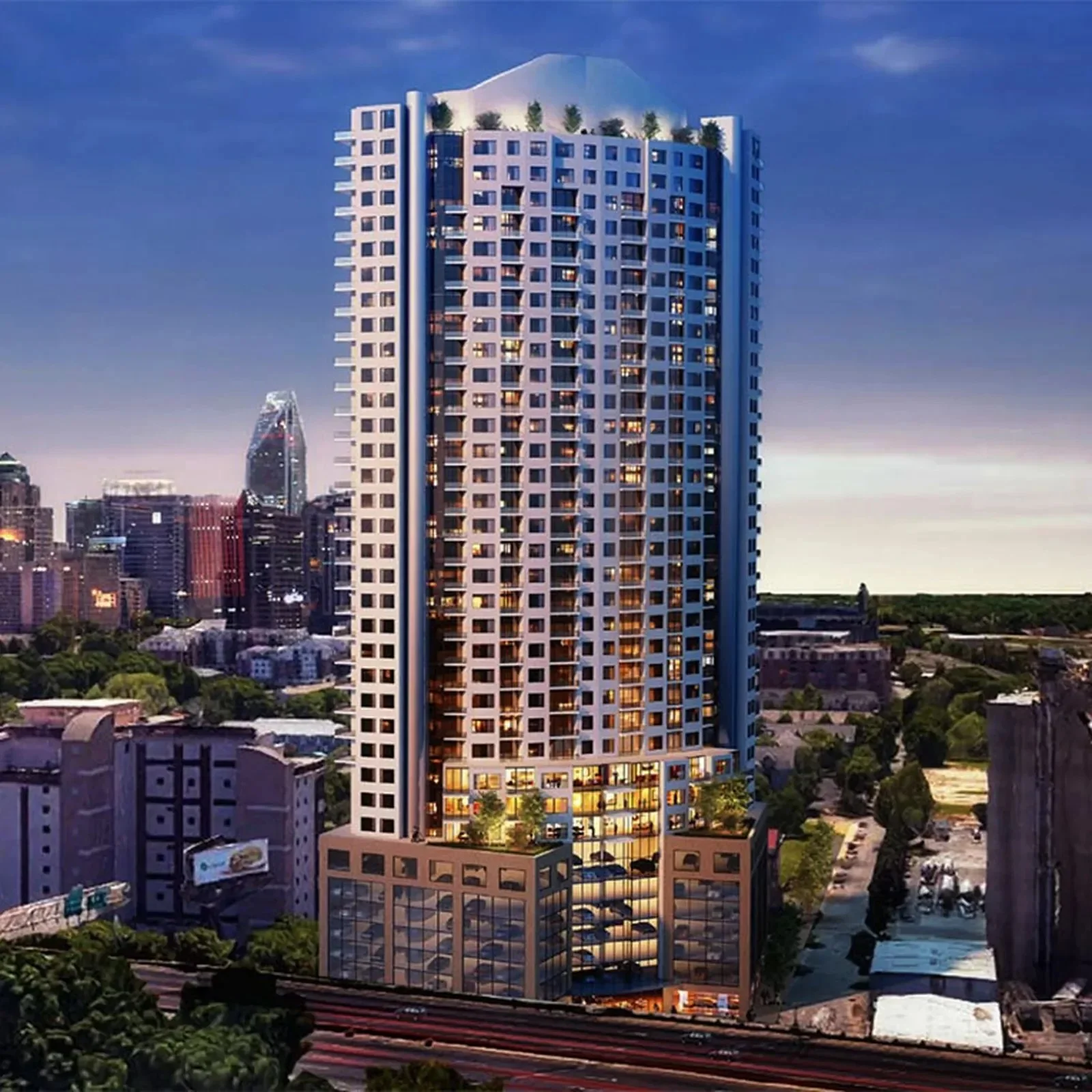 uptown-charlotte-nc-luxury-high-rise-condo-towers-at-dusk-aerial-view.webp