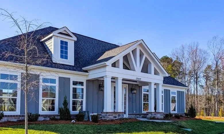 the-courtyards-on-lake-norman-clubhouse-exterior-with-white-gables-and-lawn-active-adult-community-cornelius-nc.jpg