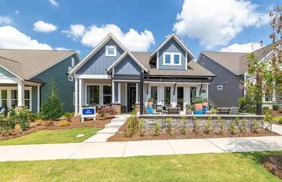 encore-at-streamside-model-home-exterior-with-front-porch-active-adult-community-waxhaw-nc.jpg