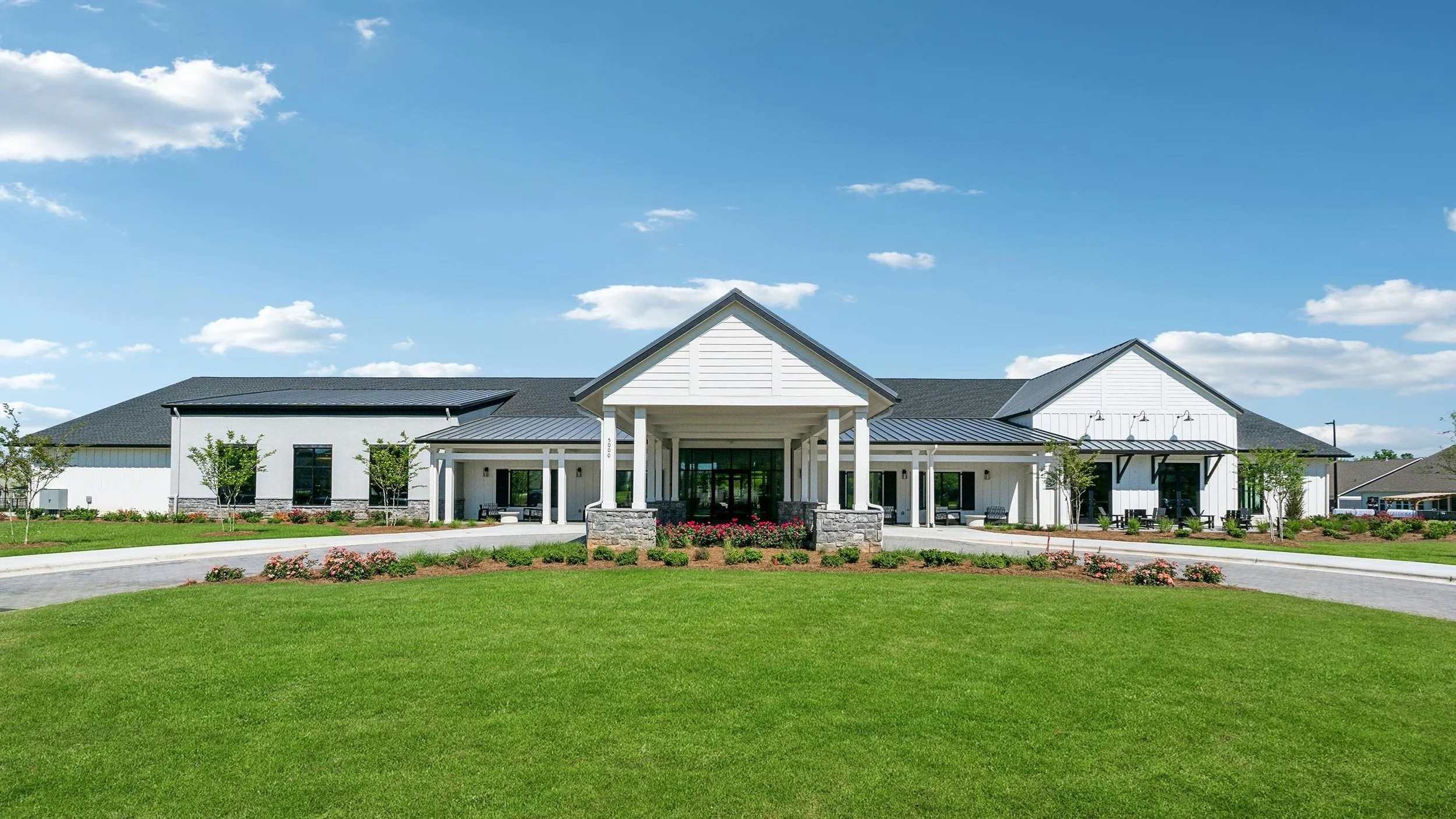cresswind-at-wesley-chapel-clubhouse-front-exterior-with-lawn-angle-view-55-plus-community-wesley-chapel-nc.jpg