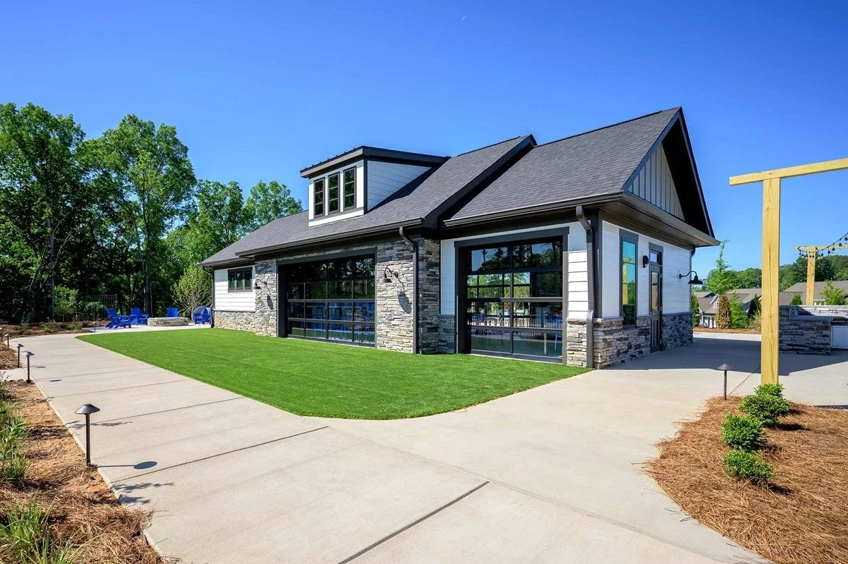 encore-at-streamside-clubhouse-exterior-with-glass-doors-and-lawn-active-adult-community-waxhaw-nc.jpg