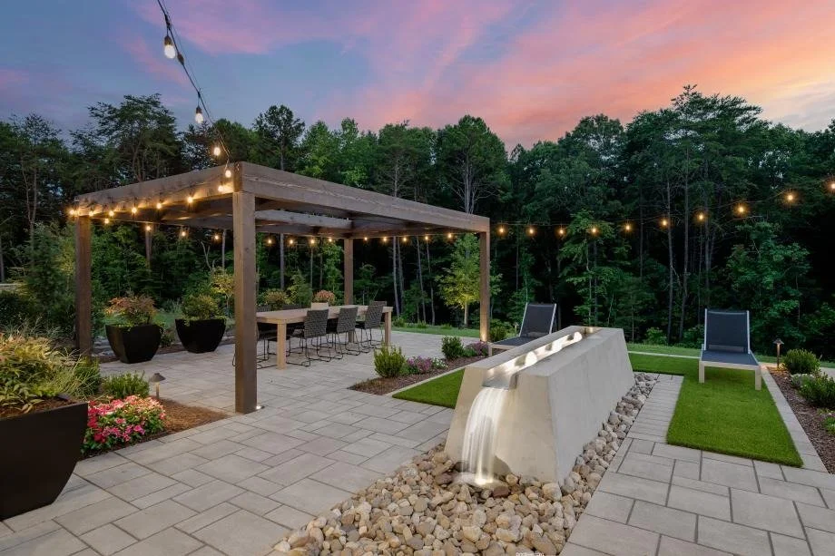 the-pines-at-sugar-creek-backyard-patio-with-pergola-and-outdoor-kitchen-at-sunset-new-home-community-fort-mill-sc.jpg