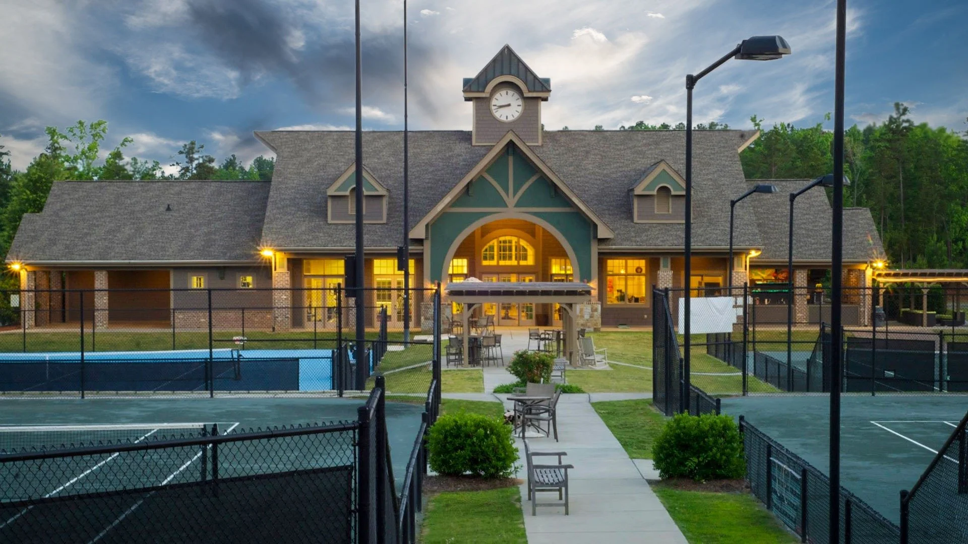 regency-at-palisades-clubhouse-rear-view-with-tennis-courts-at-dusk-55-plus-community-charlotte-nc.jpg