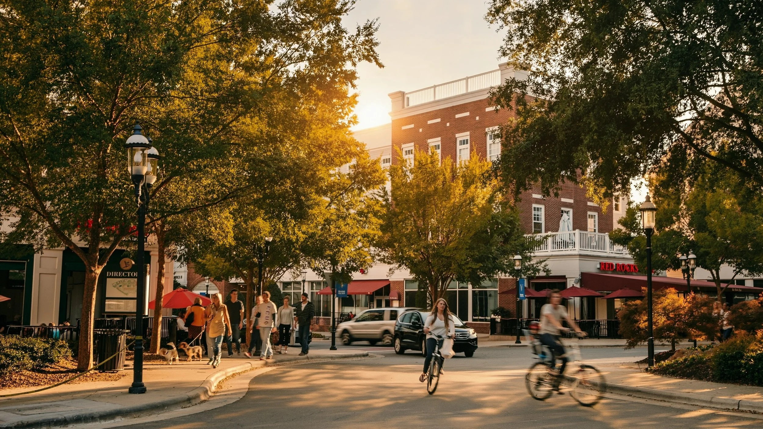 birkdale-village-shopping-street-with-cyclists-and-storefronts-at-sunset-huntersville-nc.jpg