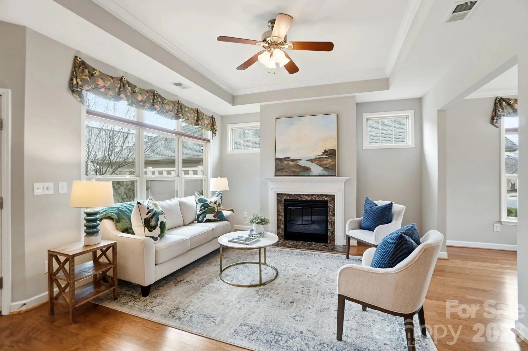 polo-club-at-mountain-island-lake-living-room-with-fireplace-and-large-window-active-adult-community-charlotte-nc.jpg