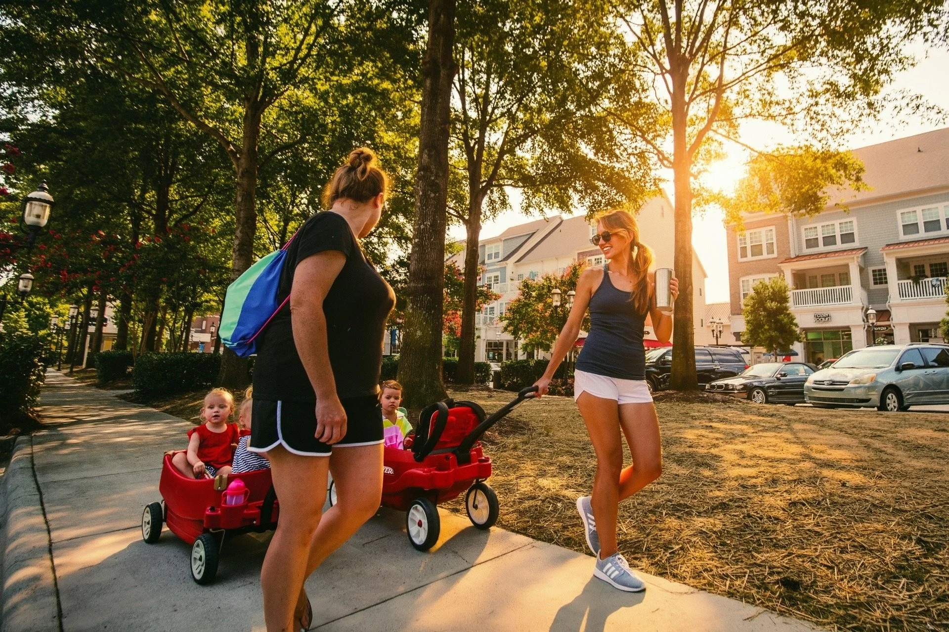 birkdale-village-families-walking-through-village-green-at-sunset-huntersville-nc.jpg