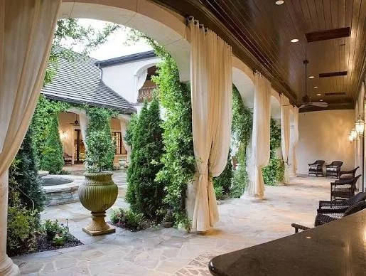 courtyards-of-marvin-covered-clubhouse-porch-with-stone-arches-and-fountain-active-adult-community-marvin-nc.jpg