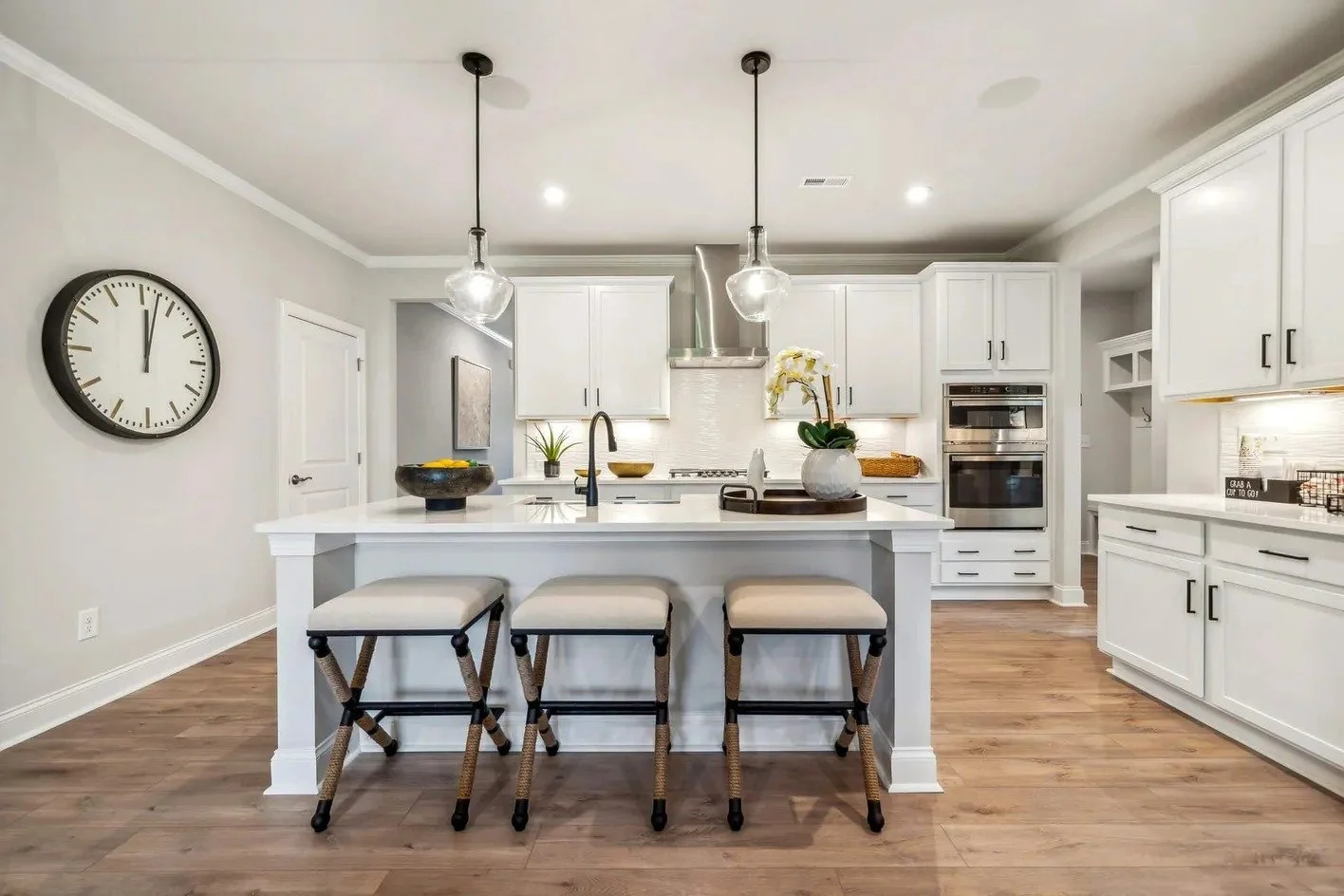 heritage-in-indian-trail-white-kitchen-with-large-island-and-pendant-lights-active-adult-community-indian-trail-nc.jpg