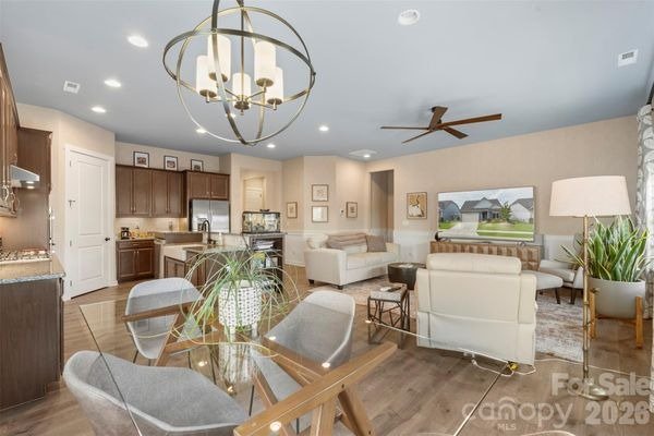 pinnacle-at-wesley-chapel-open-concept-kitchen-dining-and-living-room-active-adult-community-wesley-chapel-nc.jpg