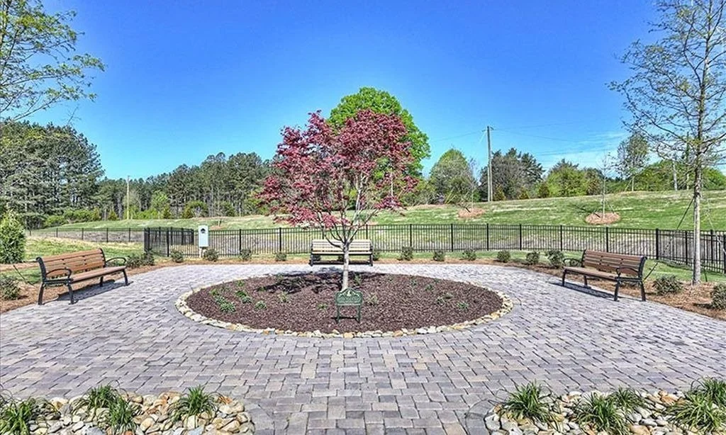pinnacle-at-wesley-chapel-paver-patio-with-bench-and-landscaped-garden-active-adult-community-wesley-chapel-nc.jpg