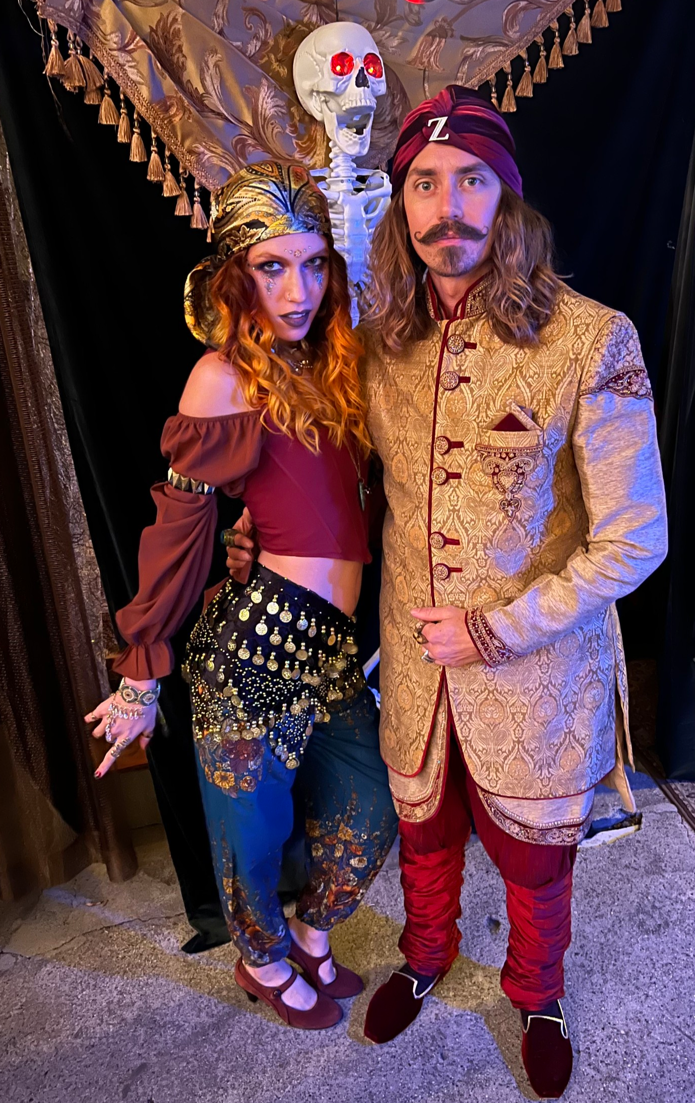 A Halloween costume styling job for a shady fortune teller and his tricky sidekick