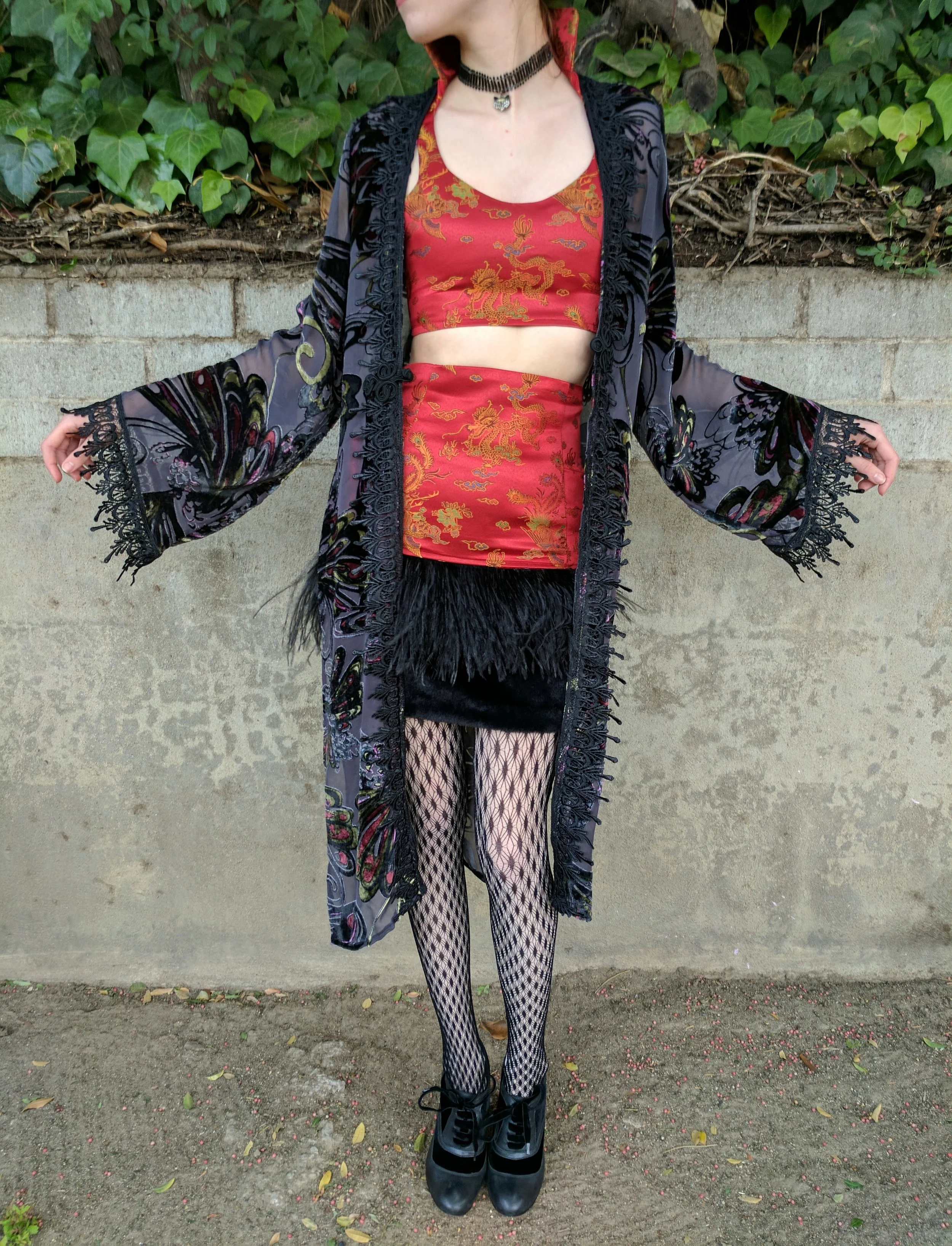 While working as an instructor at a kids school for sewing and design, we were challenged to design and create a look out of this dragon fabric and short black fur.