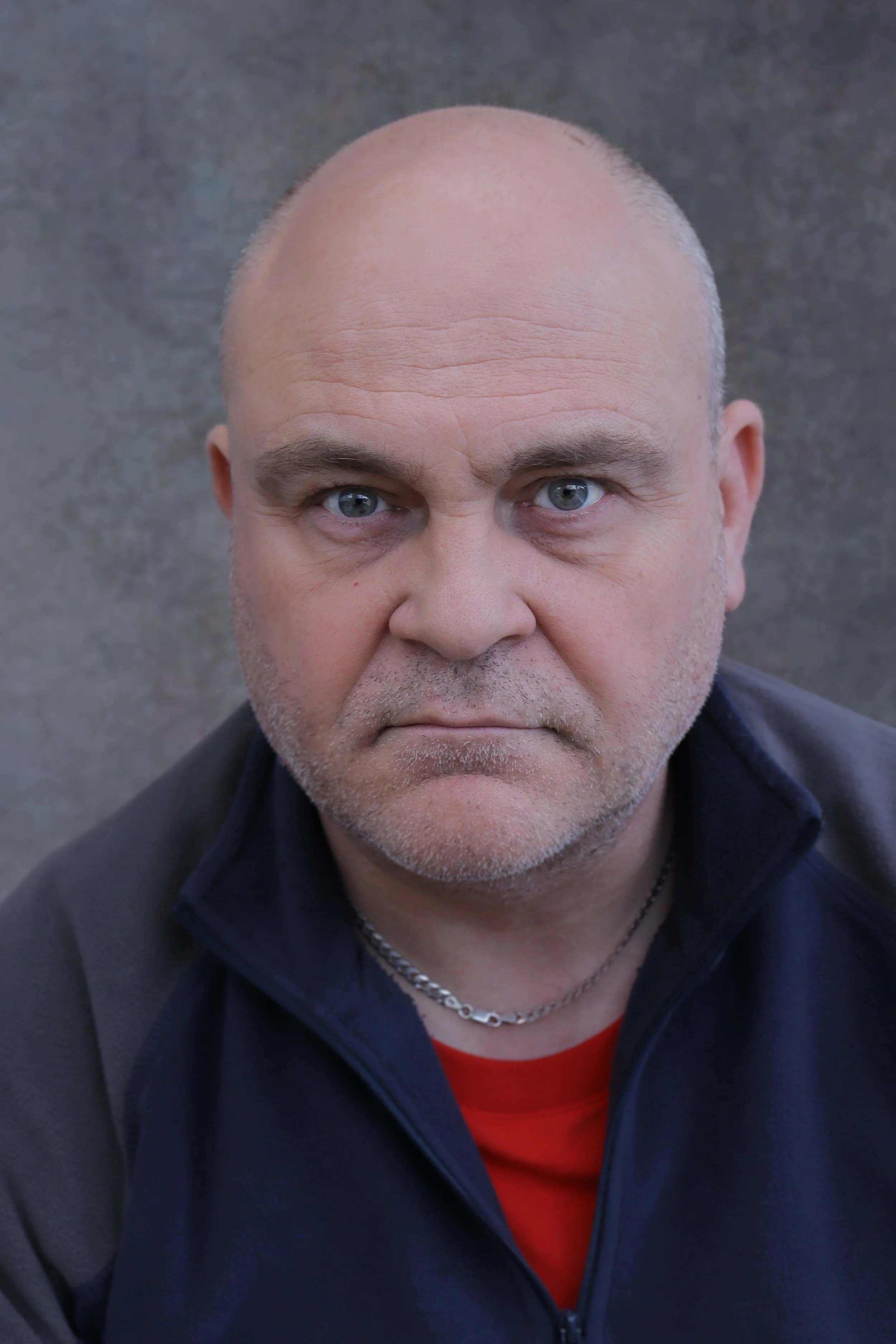 Studio headshot of male actor in natural light, capturing an expressive and character driven portrait