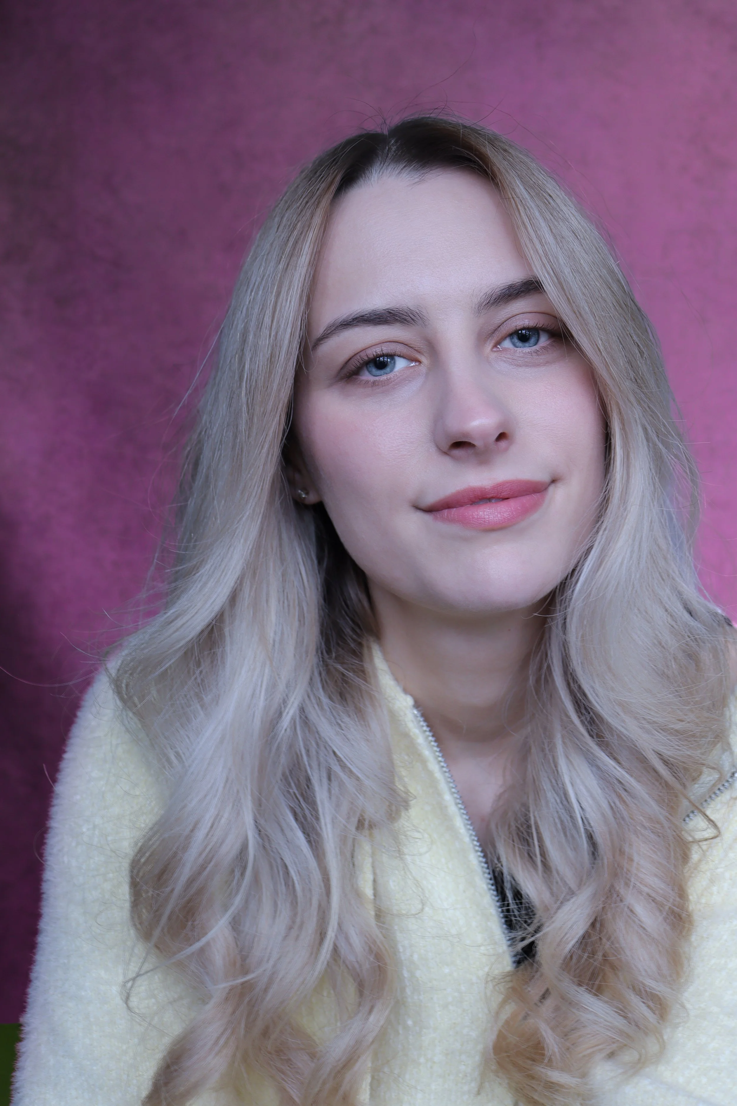 Studio headshot of female dancer in natural light, capturing expressive and performance focused presence