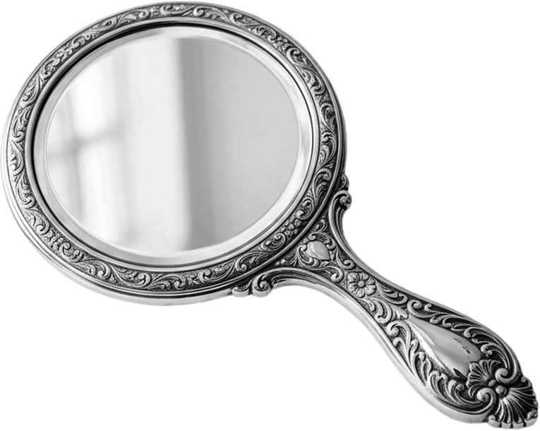 A decorative hand mirror with an ornate, floral carved handle and frame, reflecting a blurry window.