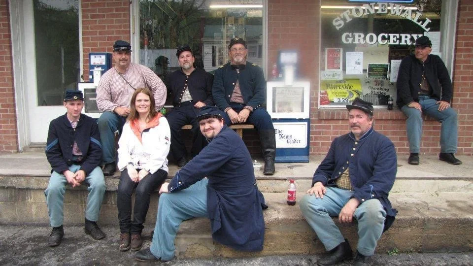 Taking a break on the steps of the Stonewall Grocery during the Battle of McDowell Reenactment 