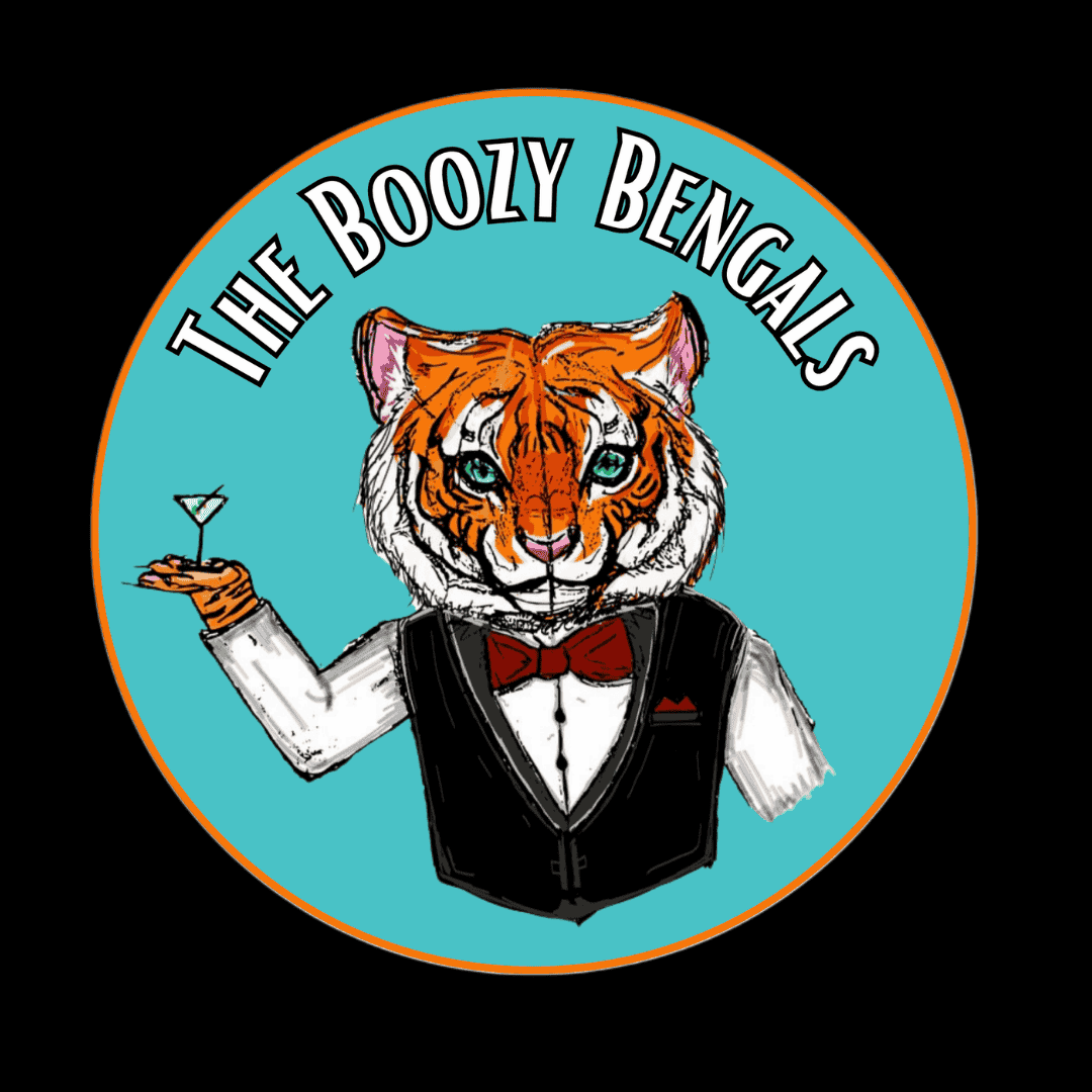 Logo for The Boozy Bengals, featuring an anthropomorphic tiger dressed as a bartender with a tuxedo and bow tie, holding a martini glass against a turquoise background with orange border.
