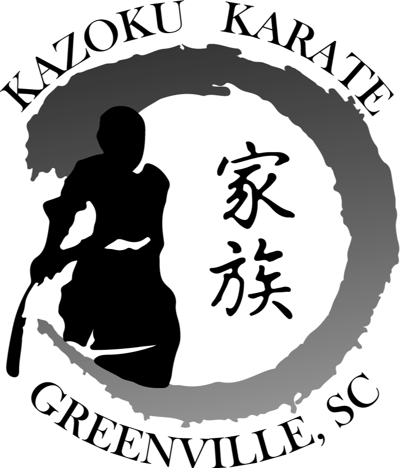 Silhouette of a person holding a phone in front of a circular mirror.