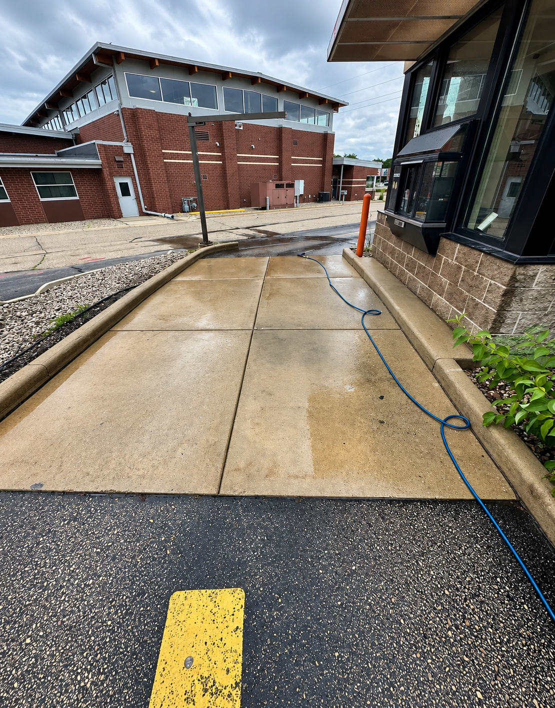 Rainy Drive-Thru Walkway pressure washing