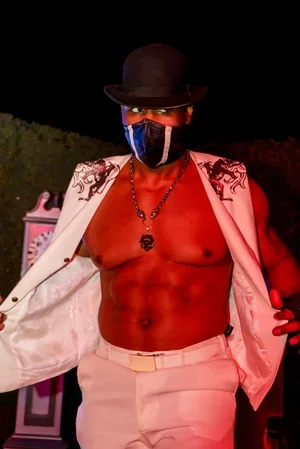 Masked Book Boyfriend posing at a Hyde & Seek immersive dark romance event in Las Vegas