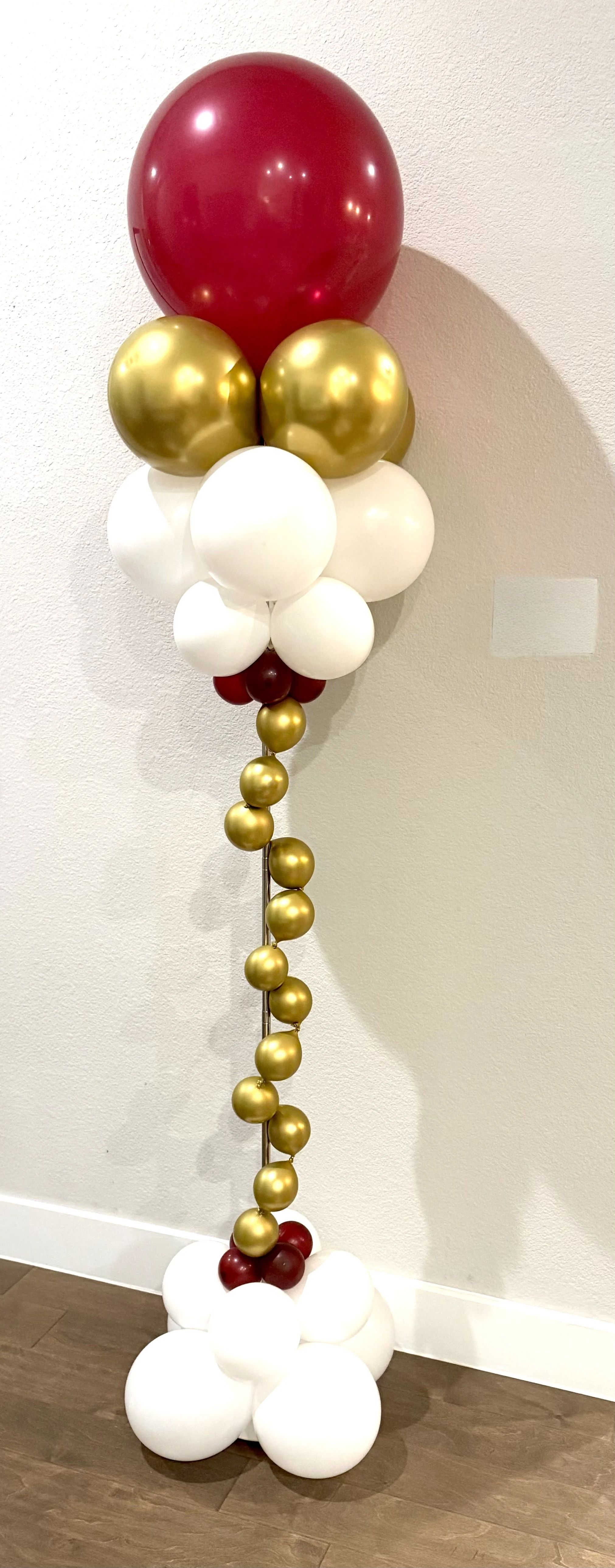 Maroon, gold and white balloon decor, created by Dripping springs based ColorPop Balloon Studio.