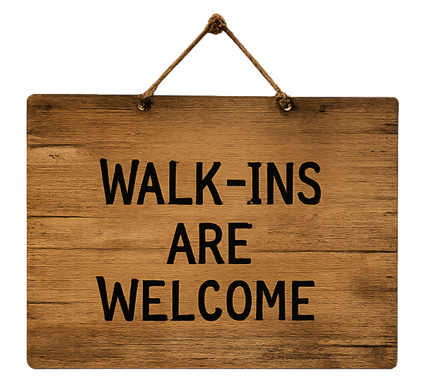 Wooden sign hanging with rope reads "Walk-ins Are Welcome".