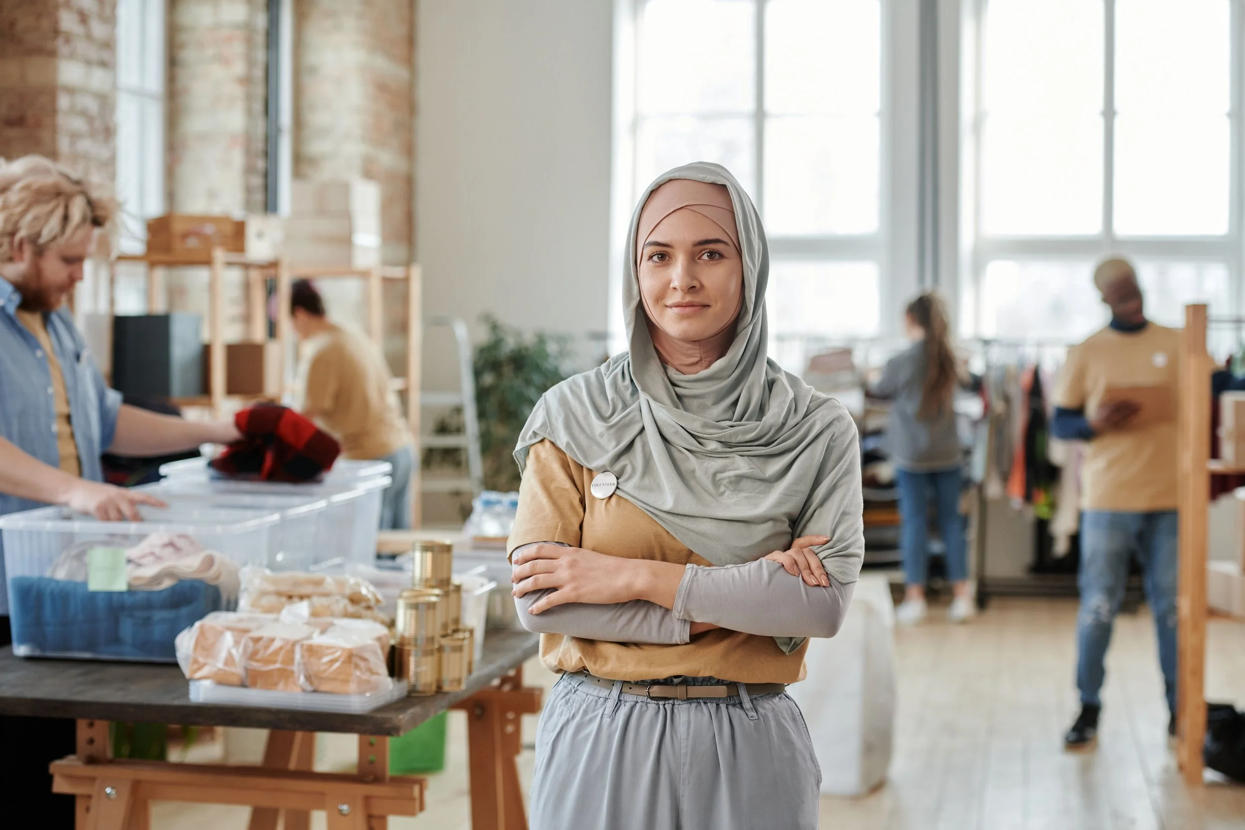 Nonprofit startup consultant standing confidently in a community workspace