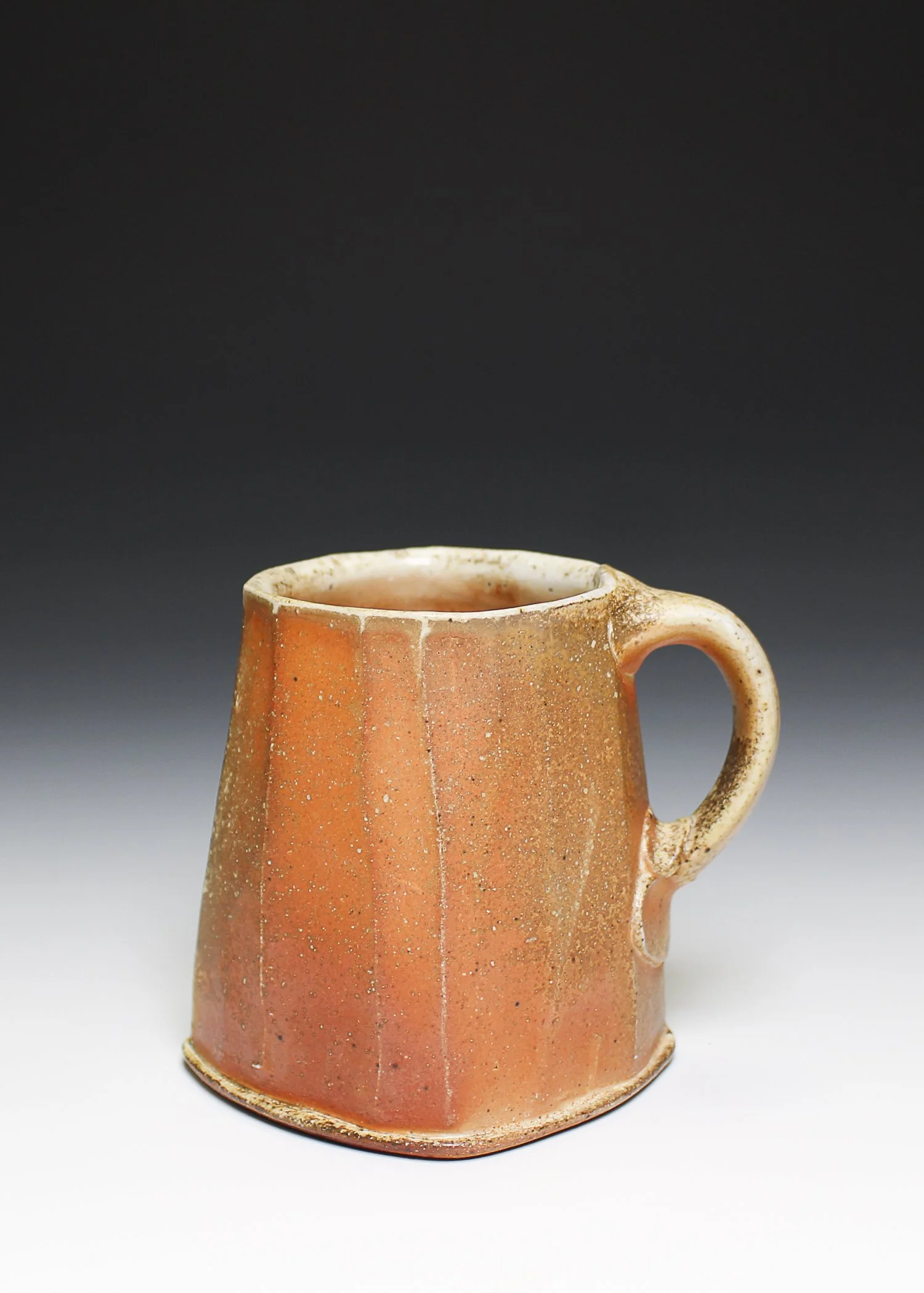 Faceted Mug, porcelaneous stoneware, flashing slip, wood-fired, (4 x 4 x 5 in), 2025.